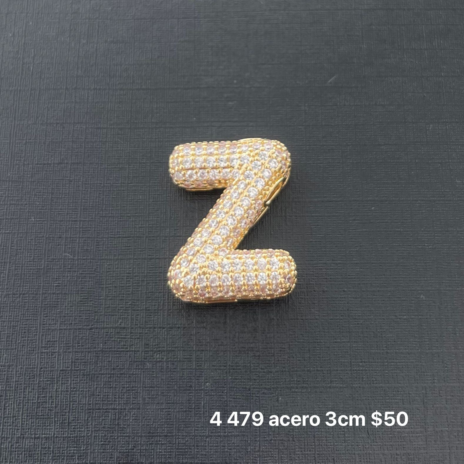 Letra transversal acero y zirconia