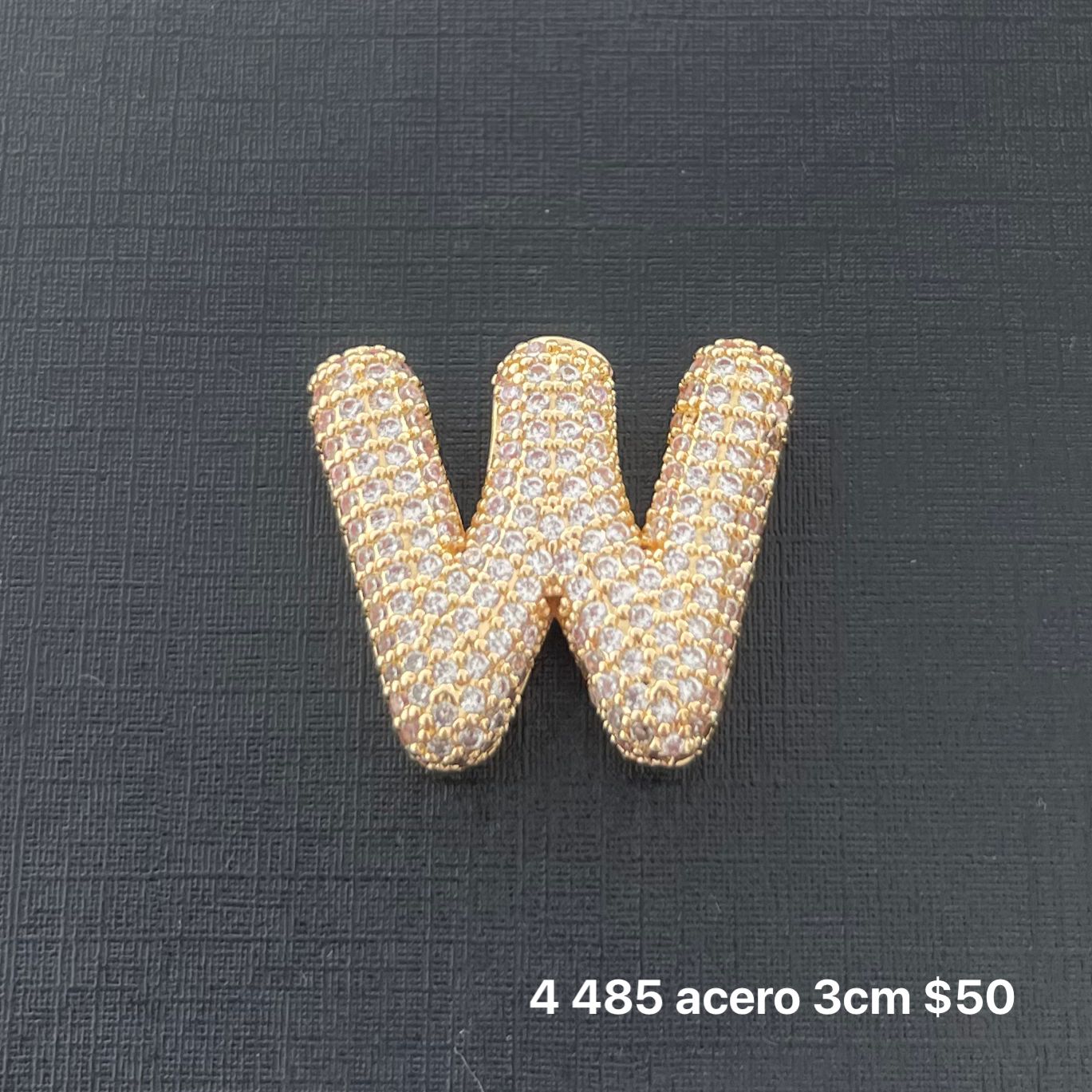 Letra transversal acero y zirconia