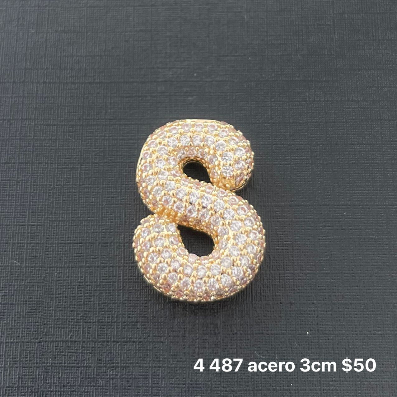 Letra transversal acero y zirconia