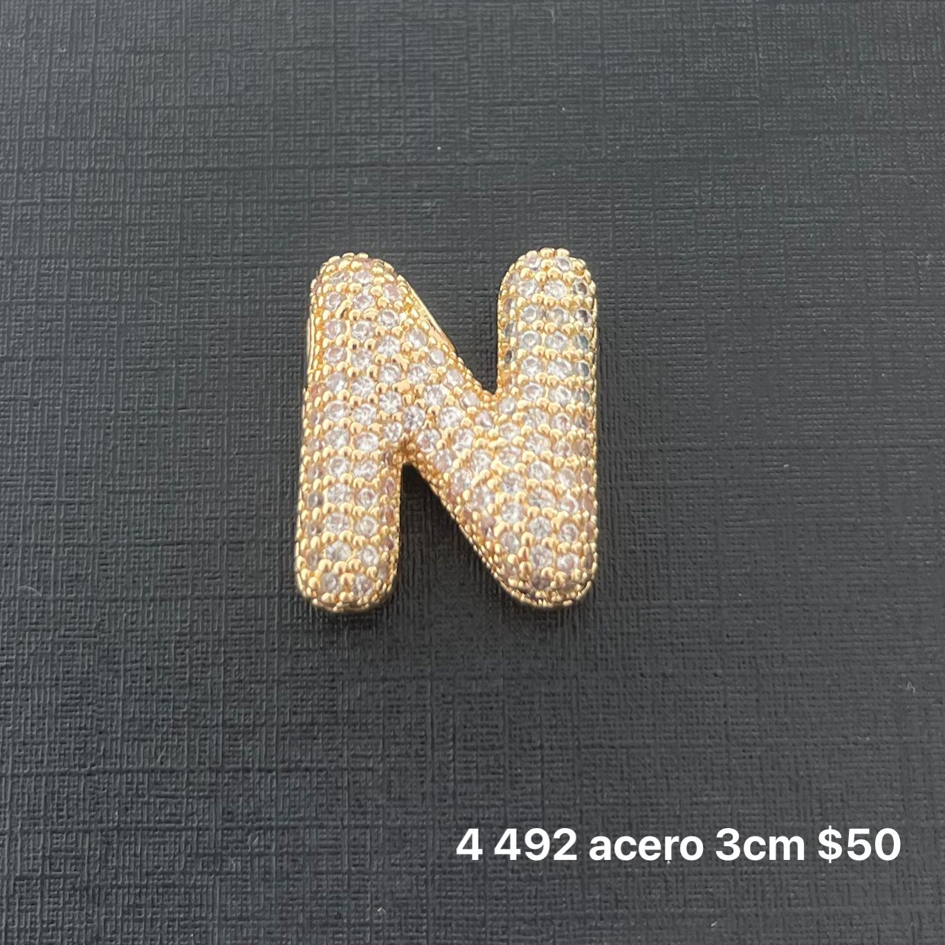 Letra transversal acero y zirconia