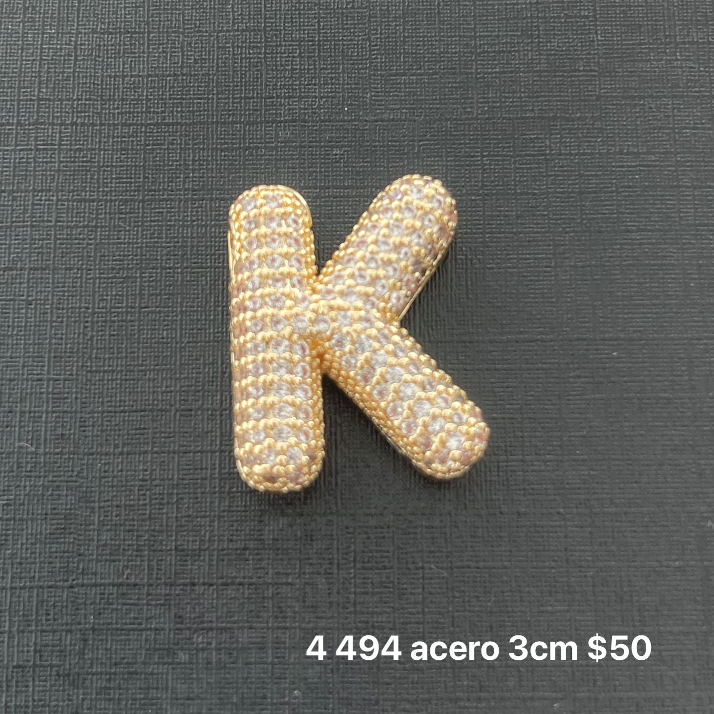 Letra transversal acero y zirconia