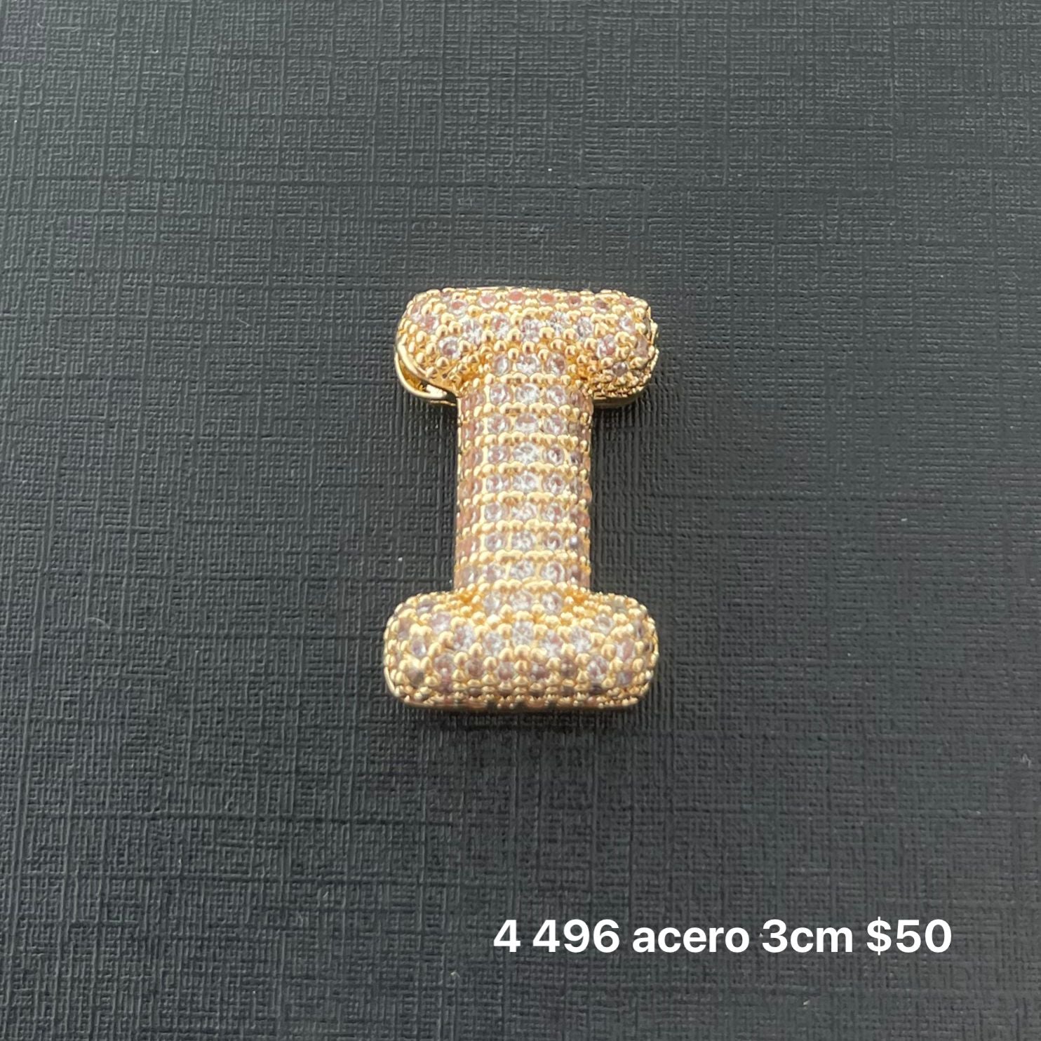 Letra transversal acero y zirconia