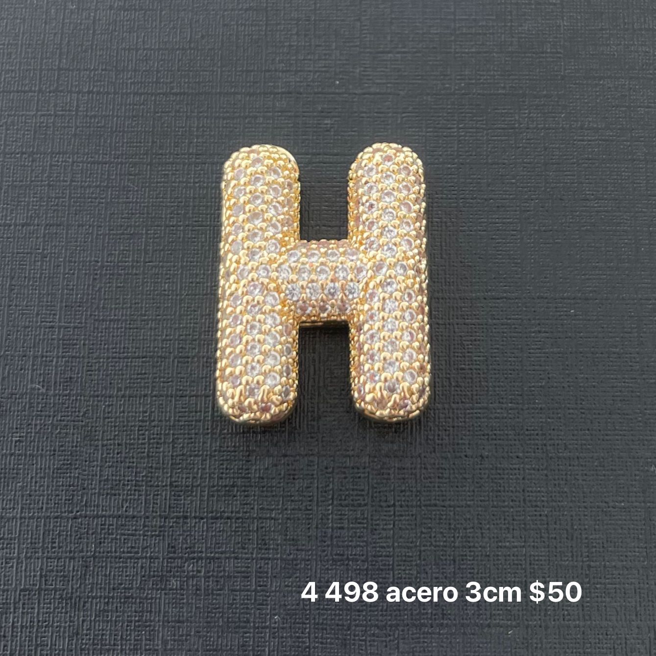 Letra transversal acero y zirconia