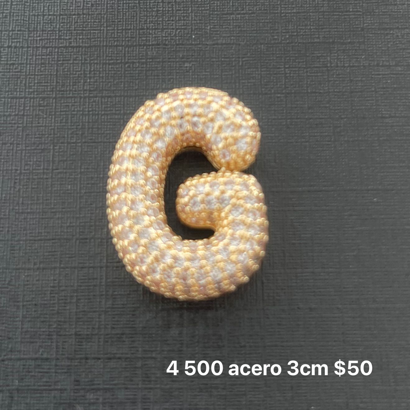 Letra transversal acero y zirconia