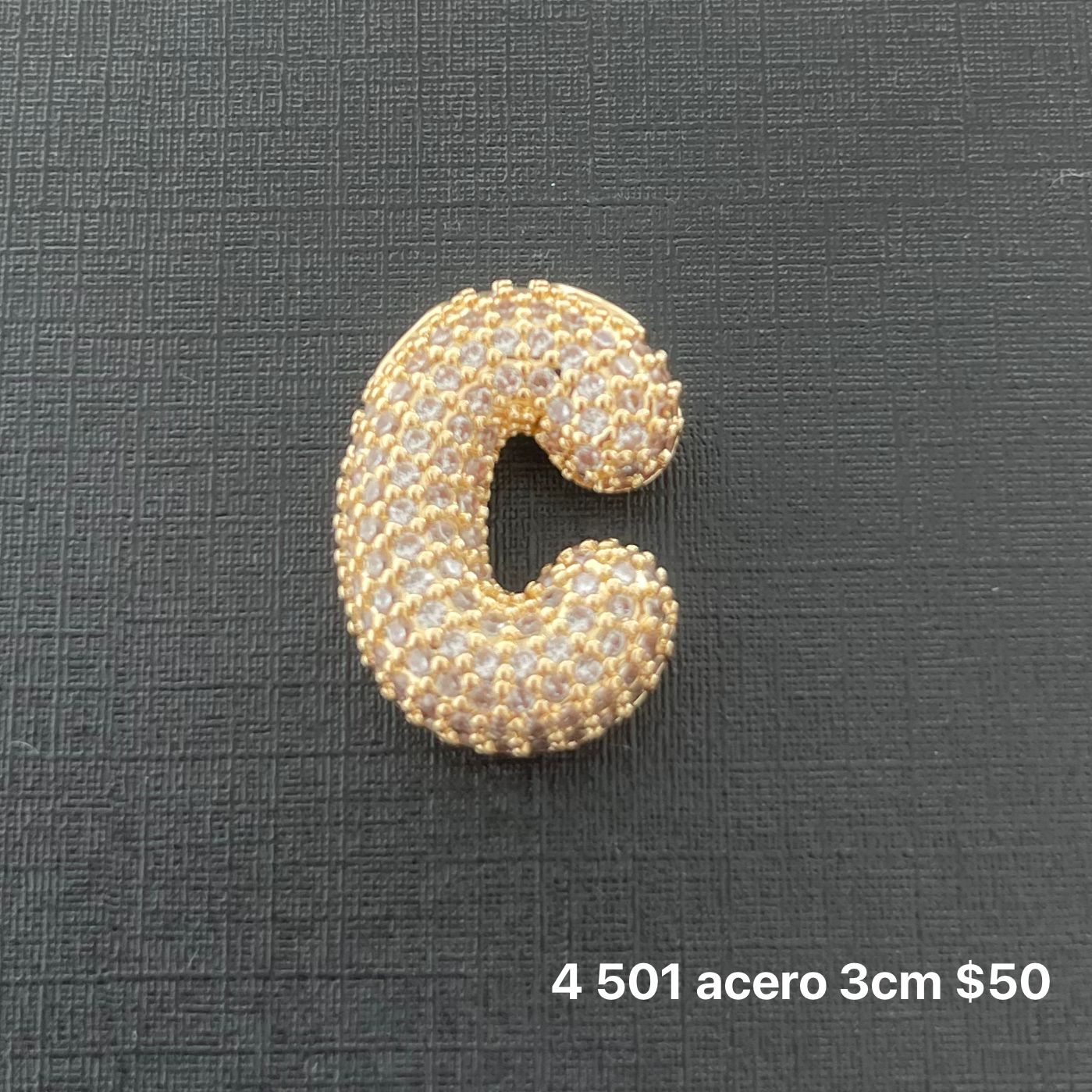 Letra transversal acero y zirconia