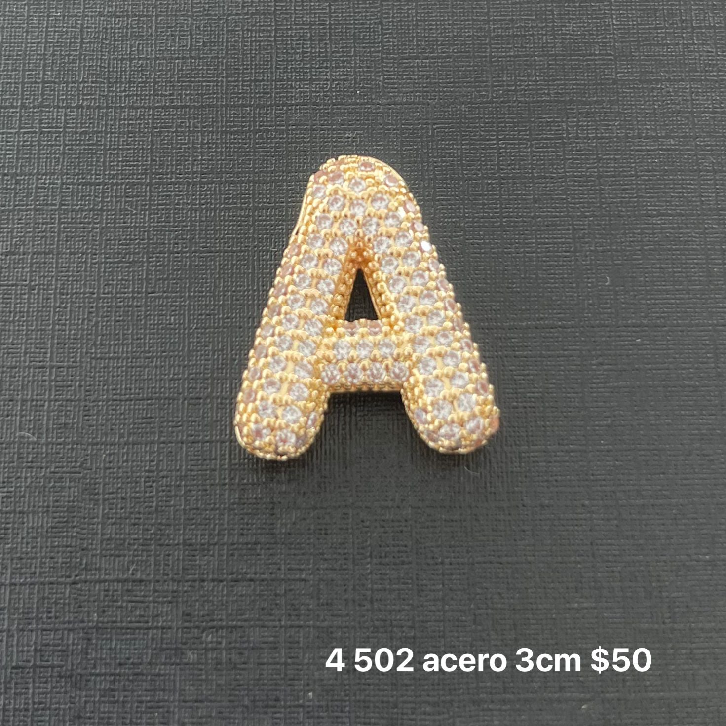 Letra transversal acero y zirconia